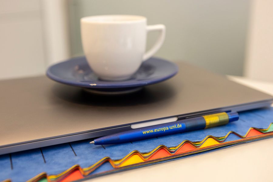 Folder, pen and cup